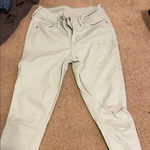 Light blue green-ish mid rise ripped jeans